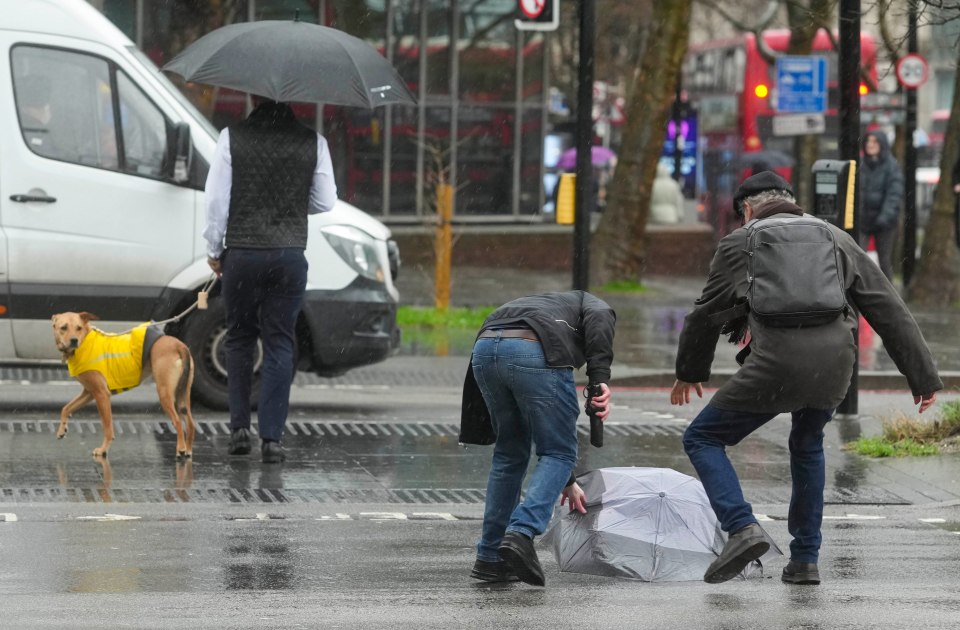 The strong wind played havoc with umbrellas in central London yesterday