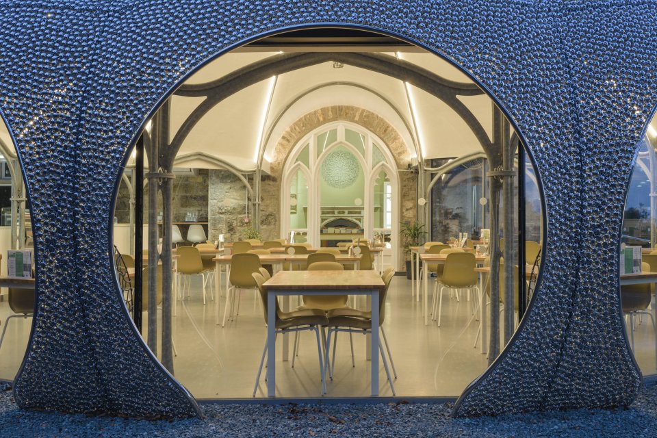 The new conservatory holds a cafe boasting four-pointed arches