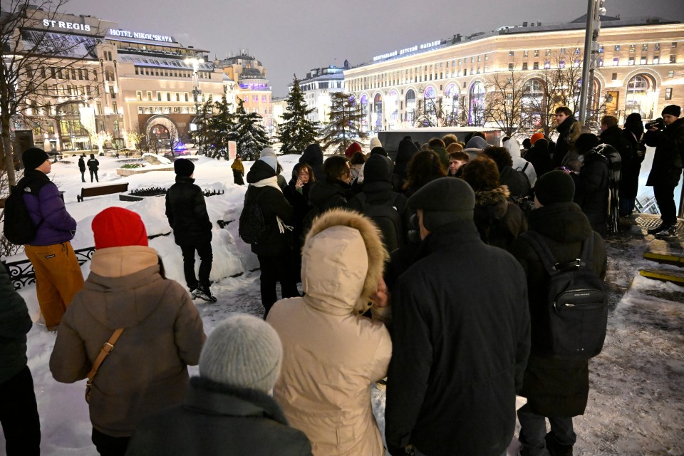 Powerful pictures showed dozens of people crowded together holding up photographs of the Kremlin critic