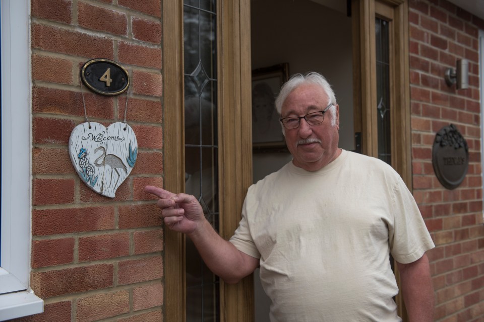 Trevor Lugmayer pointing to where a Blue Plaque use to hang saying ‘Lewis Hamilton Racing Driver lived here 1997-2001'