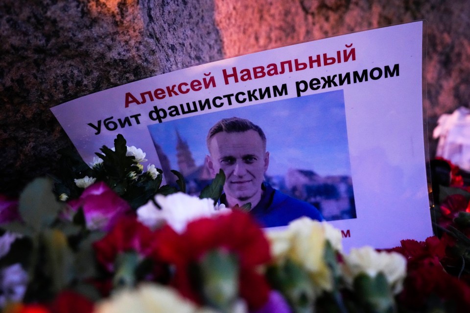 Supporters pay their last respect to Navalny with a poster that reads: ‘Alexei Navalny killed by the fascist regime’