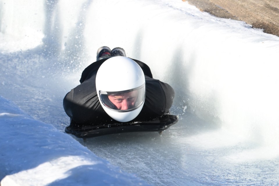 Prince Harry was seen racing down a narrow iced track on a sleigh in Canada