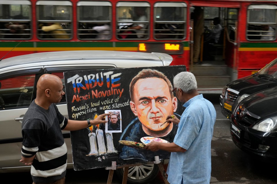 An art school teacher pays tribute to Navalny by painting a portrait of him in Mumbai, India