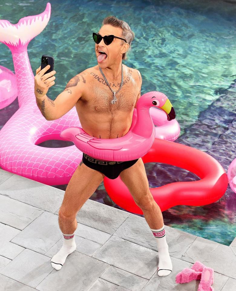 Robbie Williams has shown off his 4st body transformation by the pool