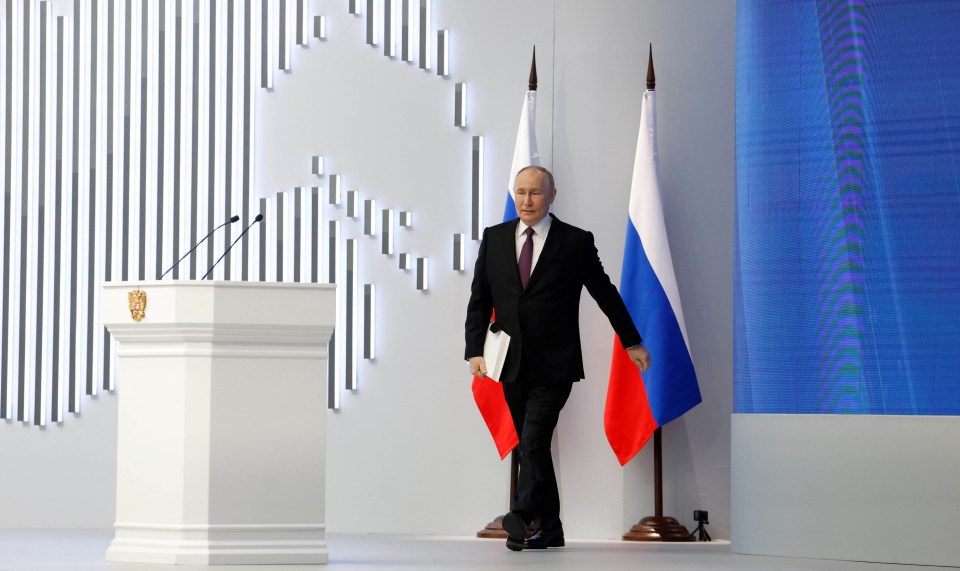 Putin half-hobbled onto the stage with a 'limp' before beginning his ridiculous speech