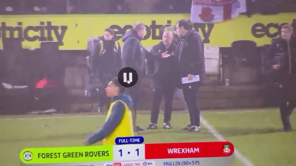 Wrexham manager Phil Parkinson engages in heated exchange with his backroom staff