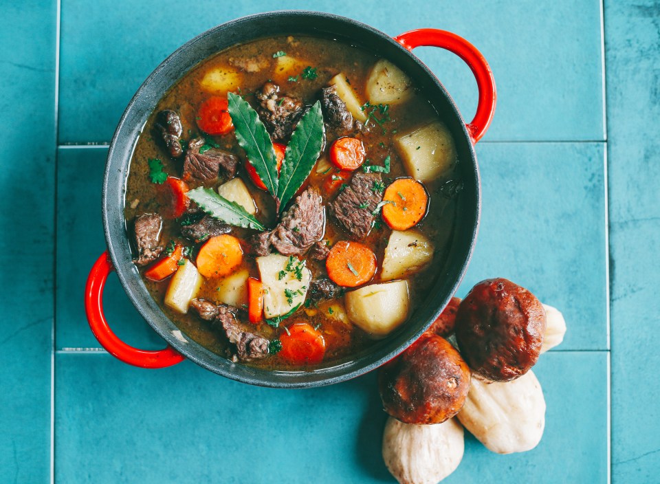 Slow Cooker Boeuf bourguignon with Boletus edulis mushrooms on green background.; Shutterstock ID 1815289817; purchase_order: -; job: -; client: -; other: -