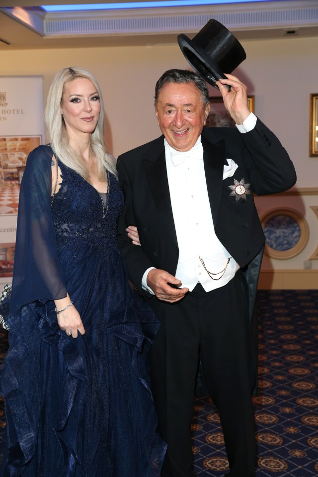 Richard is famous for persuading A-listers to join him at a lavish ball here he's pictured with actress, Simone Reilaender