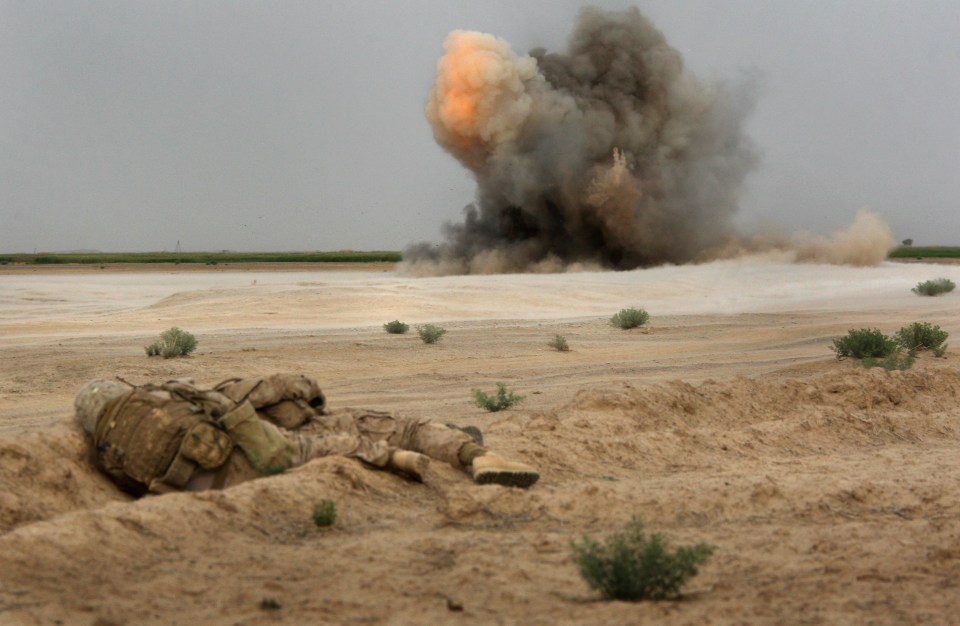 A roadside bomb explodes in March 2009 near the remote village of Baqwa in Afghanistan