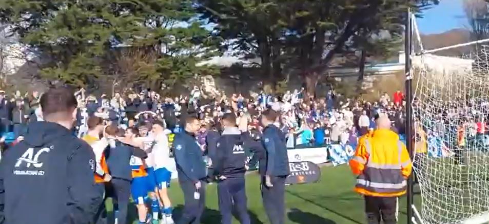 Bury's players celebrated with the fans after the final whistle