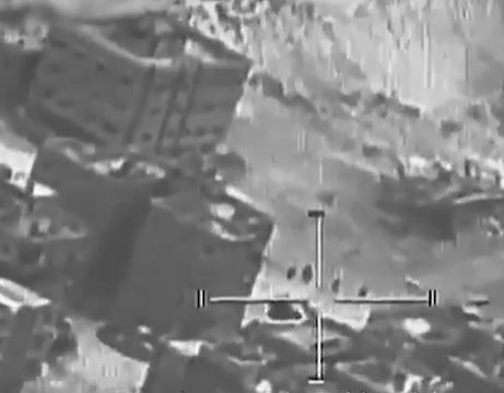 Drone footage shows the troops moving between the buildings