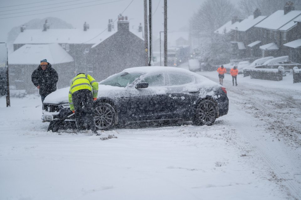 Vehicles get stuck in snow between Buxton and The Cat and Fiddle on Thursday