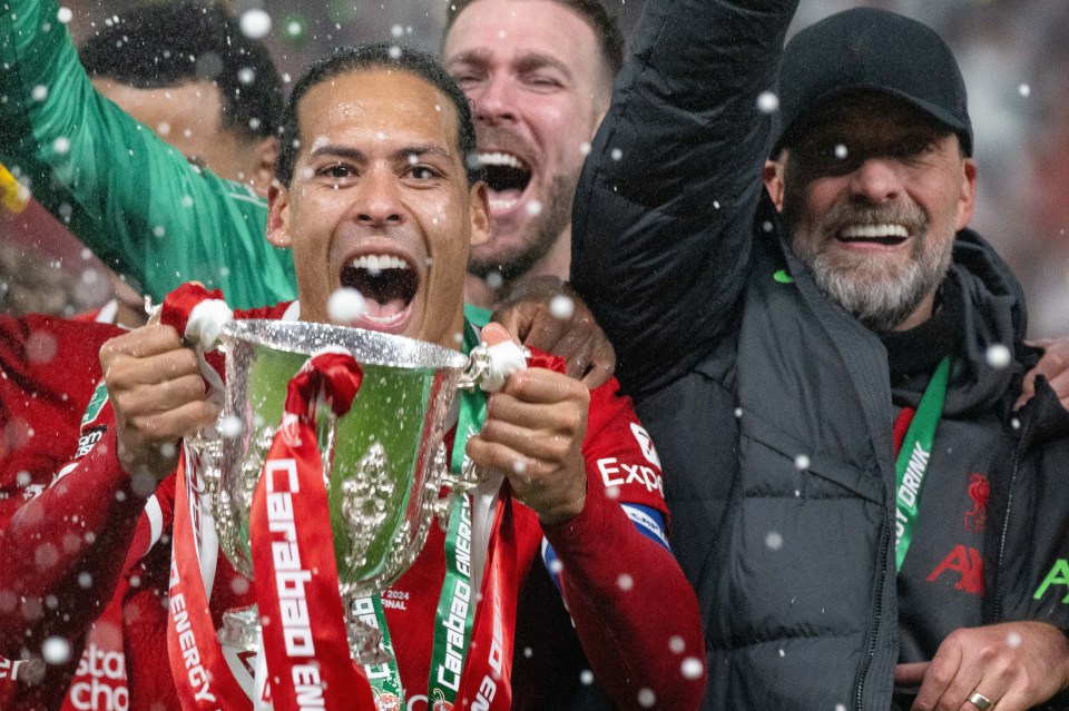 a man holding a trophy with the word canada on it