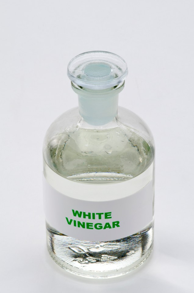 a bottle of white vinegar with a white label