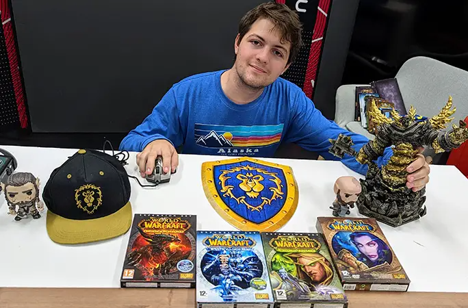 Barnabás poses with his World of Warcraft collection