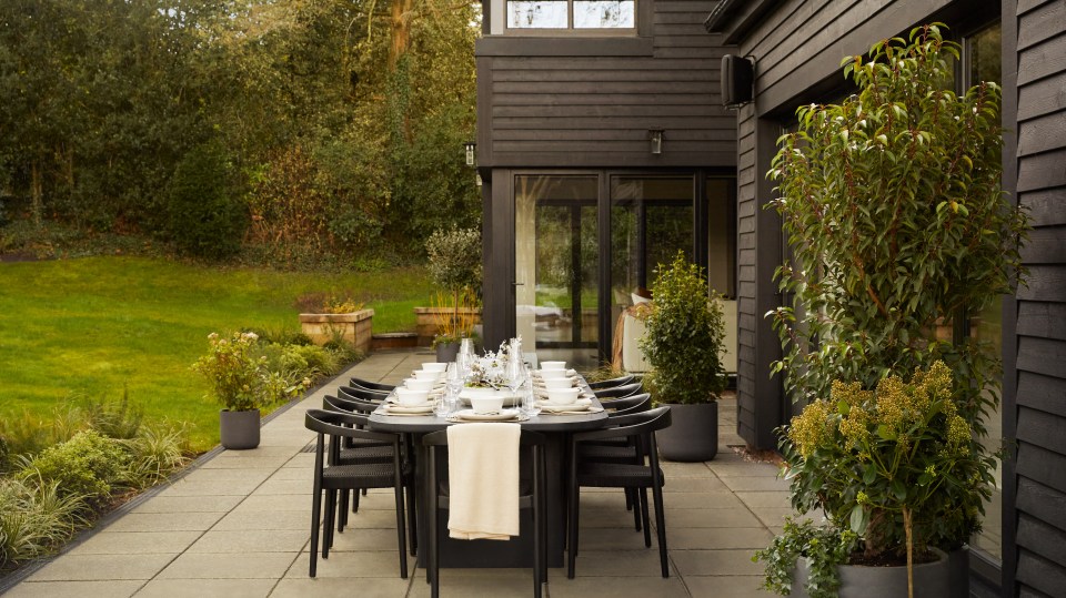 The main living room features more bi-folding doors that also open onto the rear garden