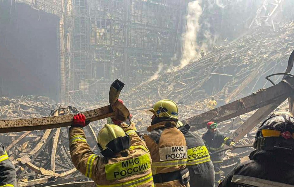 Rescuers continue to pull bodies from the rubble