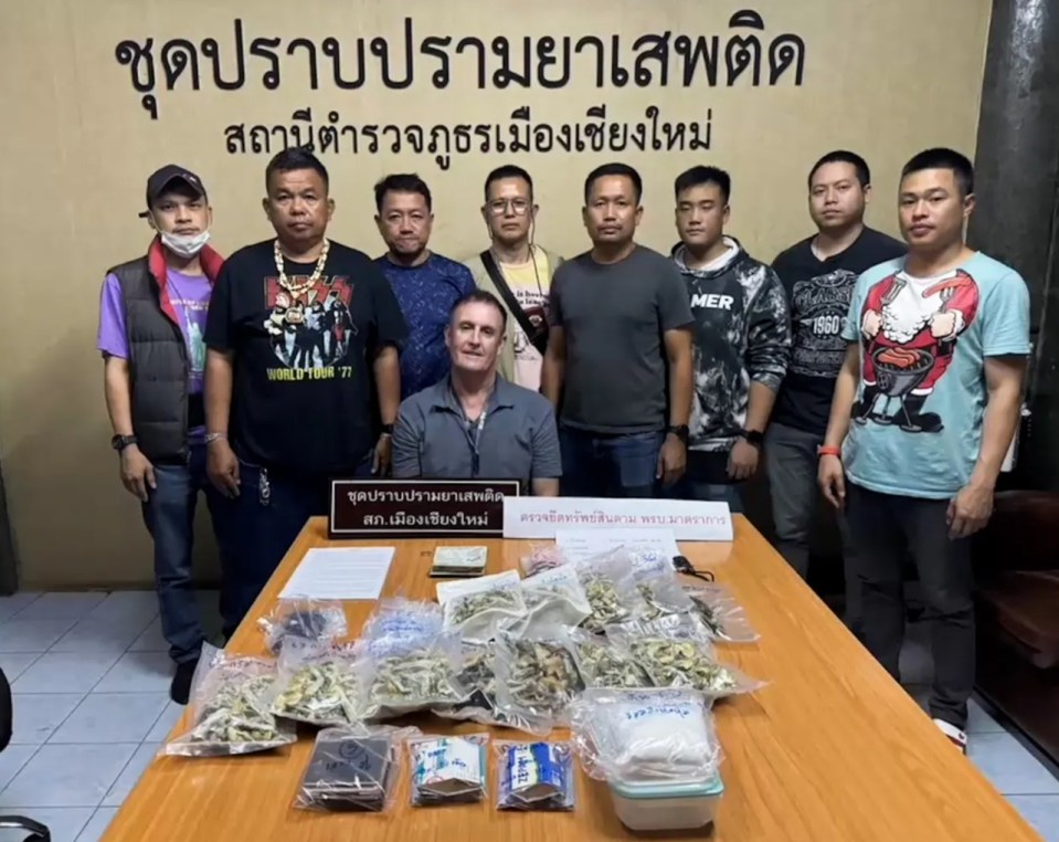 Charly Garcia, 48, pictured smirking in front of undercover Thai cops with the drugs he is alleged to have been caught with