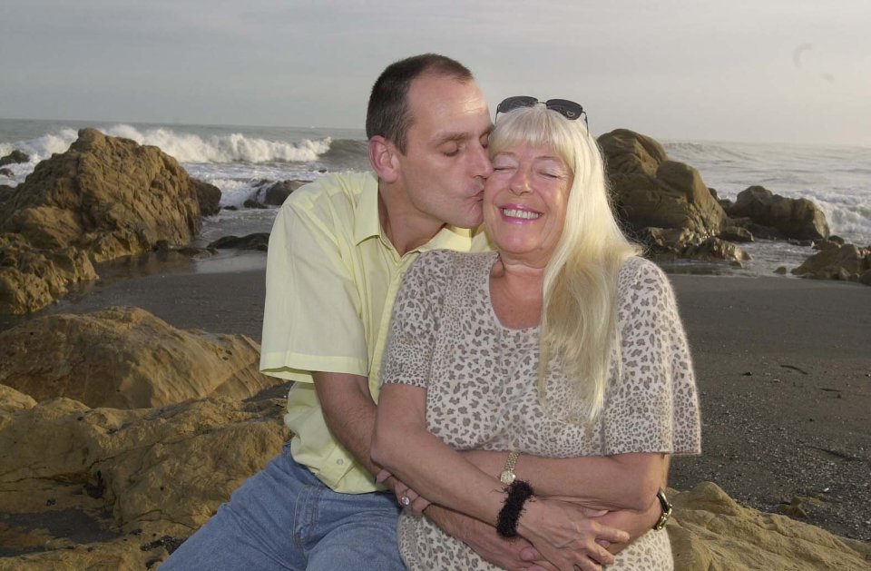 Scott and Julie, who married in 2007, met when he delivered plaster to help renovate her home near Rochdale in Greater Manchester. Pictured, in Spain in 2003