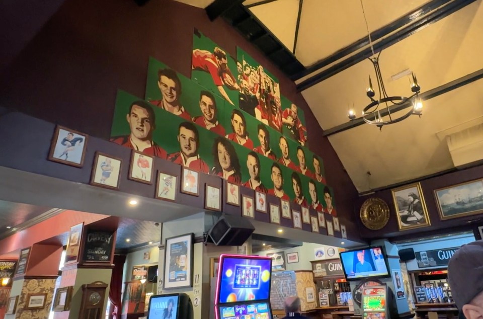 One wall inside The Queen's Vaults pub pays tributes to Welsh rugby legends