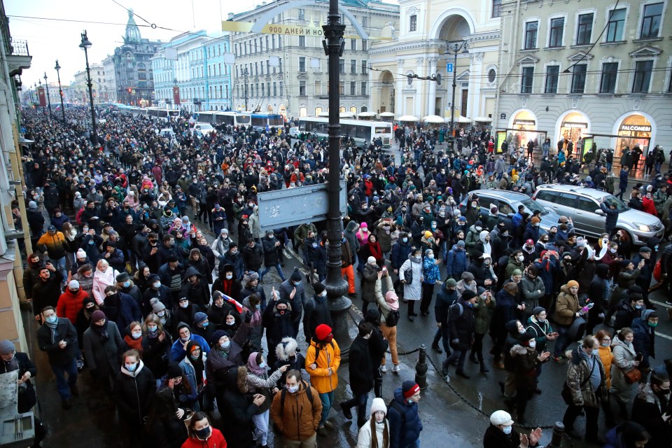 People march during a protest against the jailing of Navalny in St.Petersburg in 2021