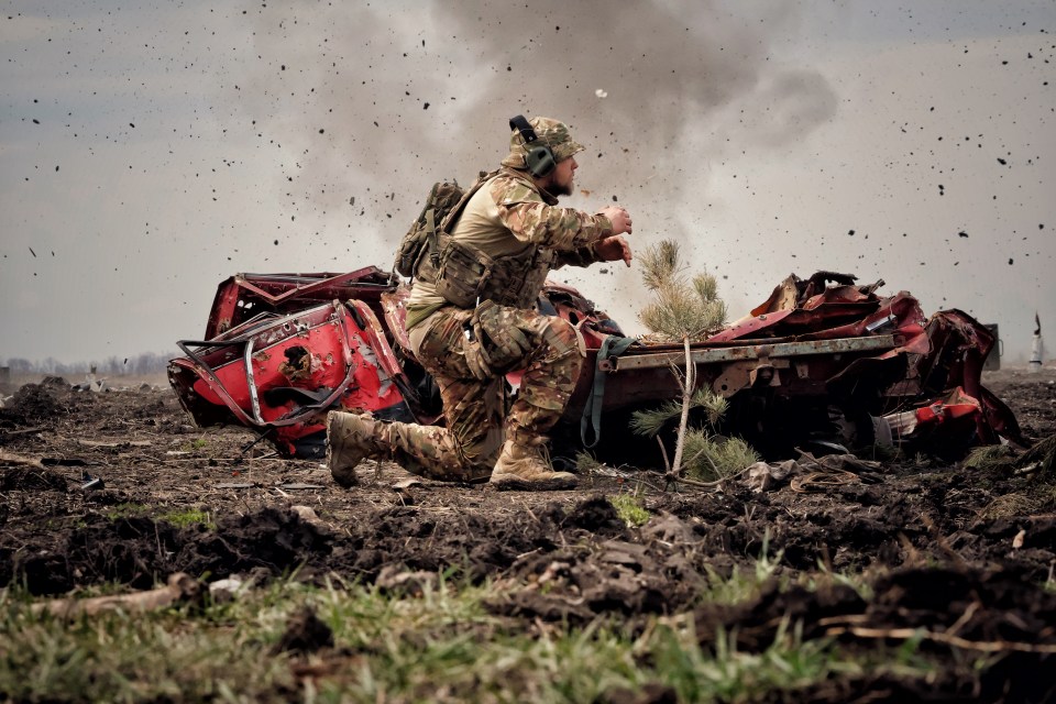 Ukrainian military men train with hand grenades in Liman in April last year