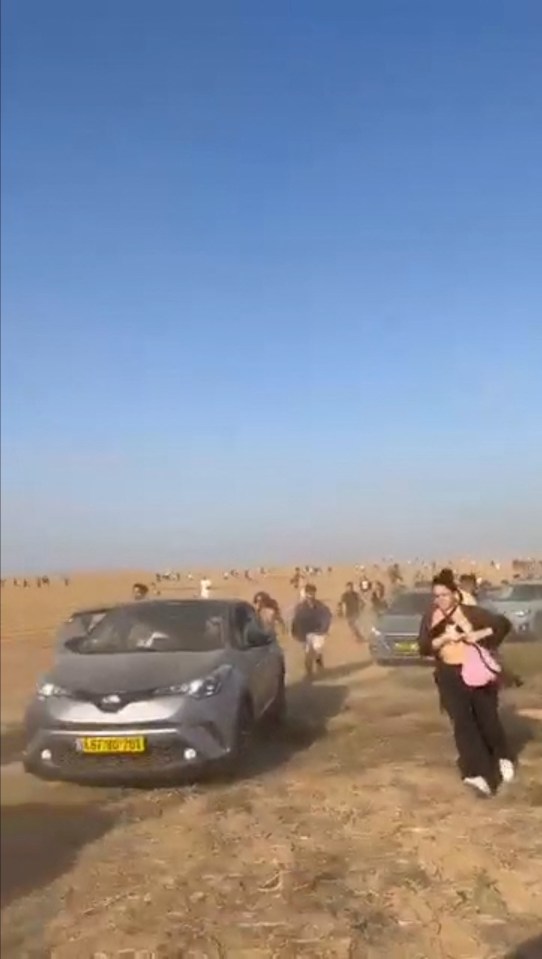 People at a dance party flee during a surprise attack launched by Hamas