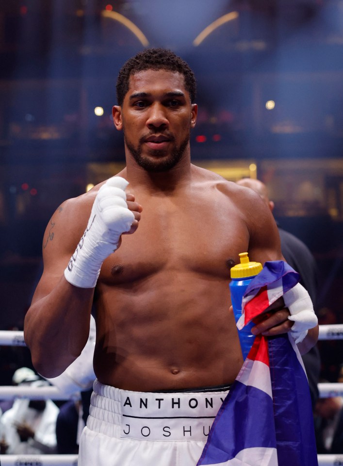 Anthony Joshua celebrates knocking out Francis Ngannou