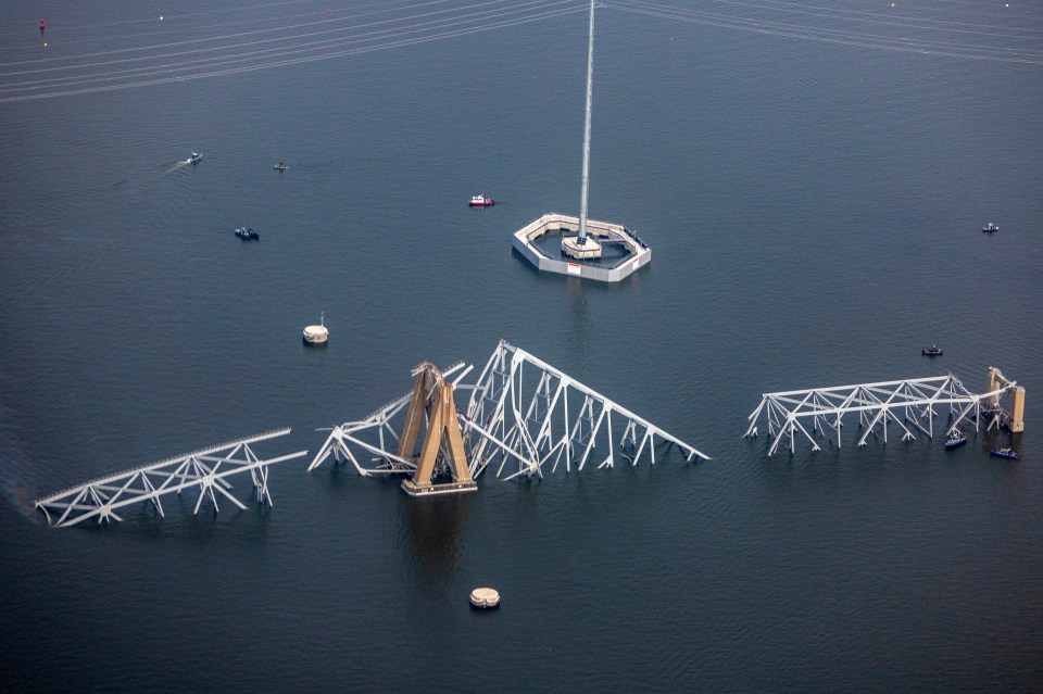 Pieces of the Baltimore bridge can be seen sticking out of the water