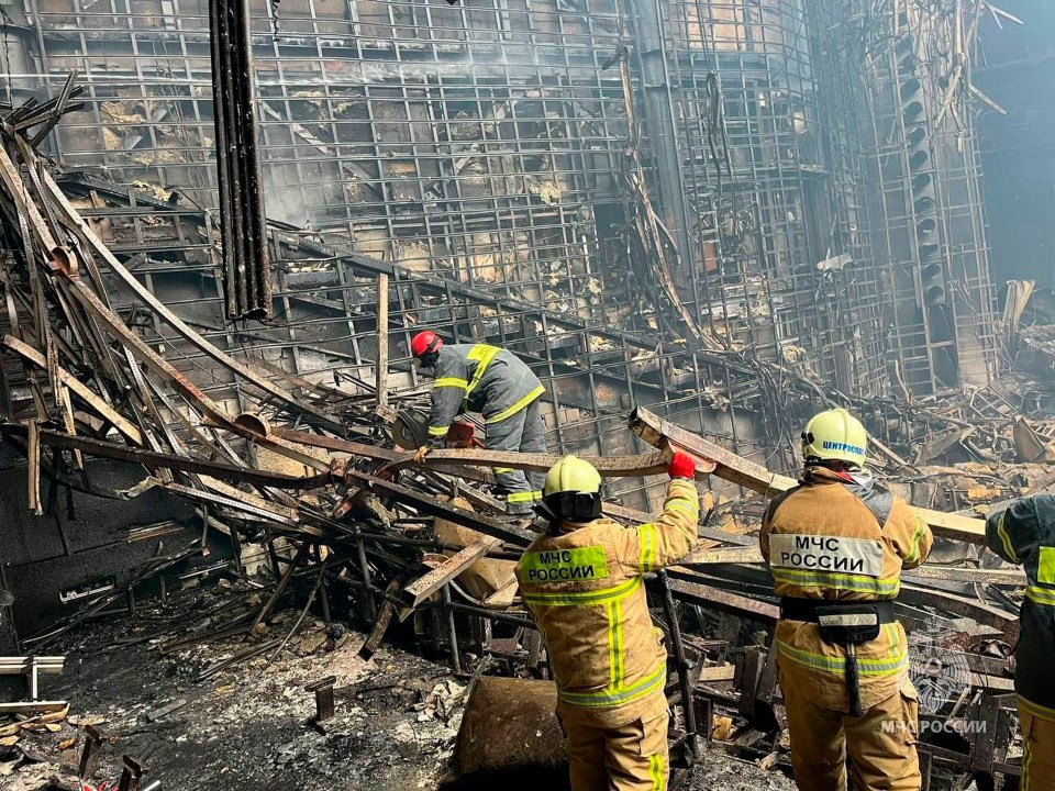 Emergency workers dig through the rubble after Friday's attack