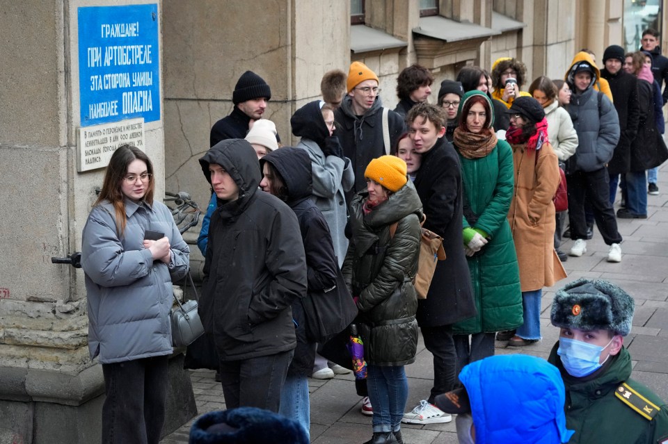 Voters queue up in St Petersburg, Russia, for the last day of voting