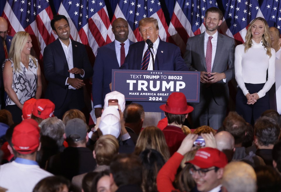 Greene, far left, pictured at a Trump rally in January in Nashua