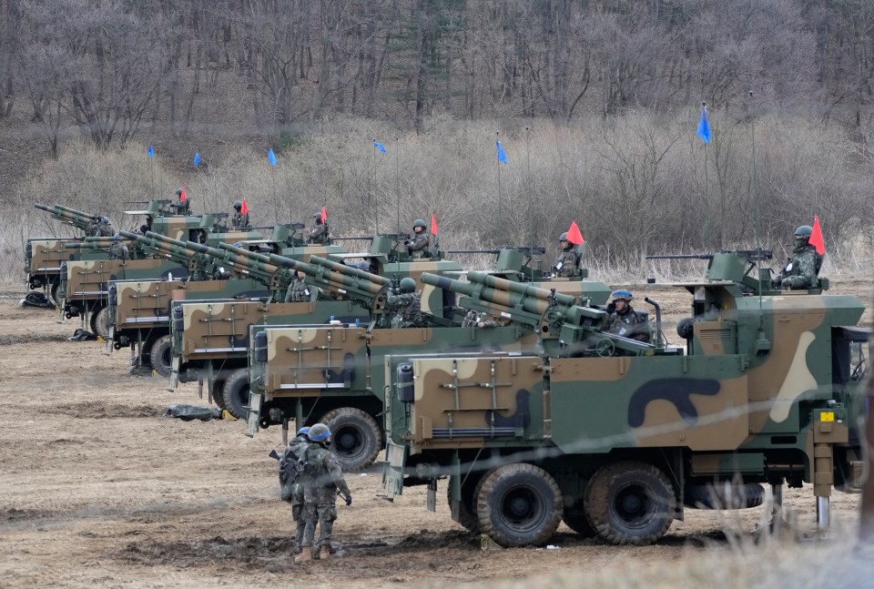 South Korea army soldiers take part in a military exercise which Kim called 'rehearsal for invasion'