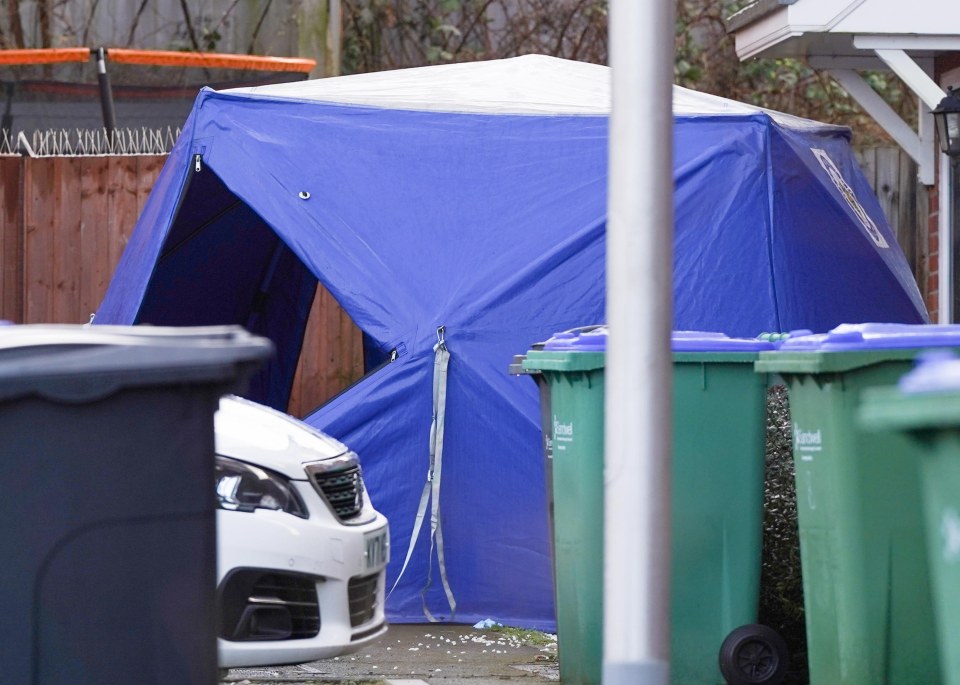 A blue tent remained up near the home this morning