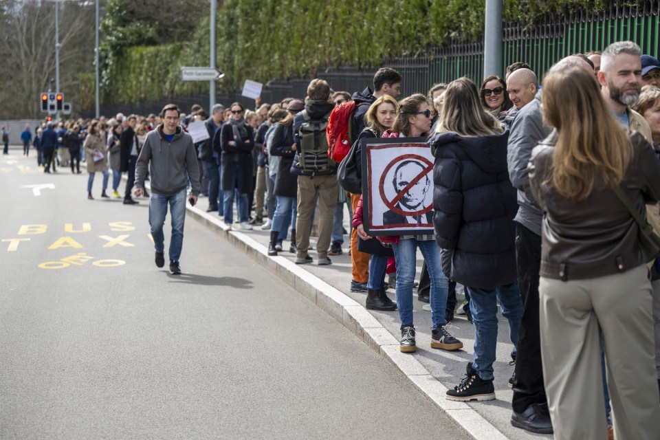 Russians living in Switzerland protest in Geneva near the embassy at noon