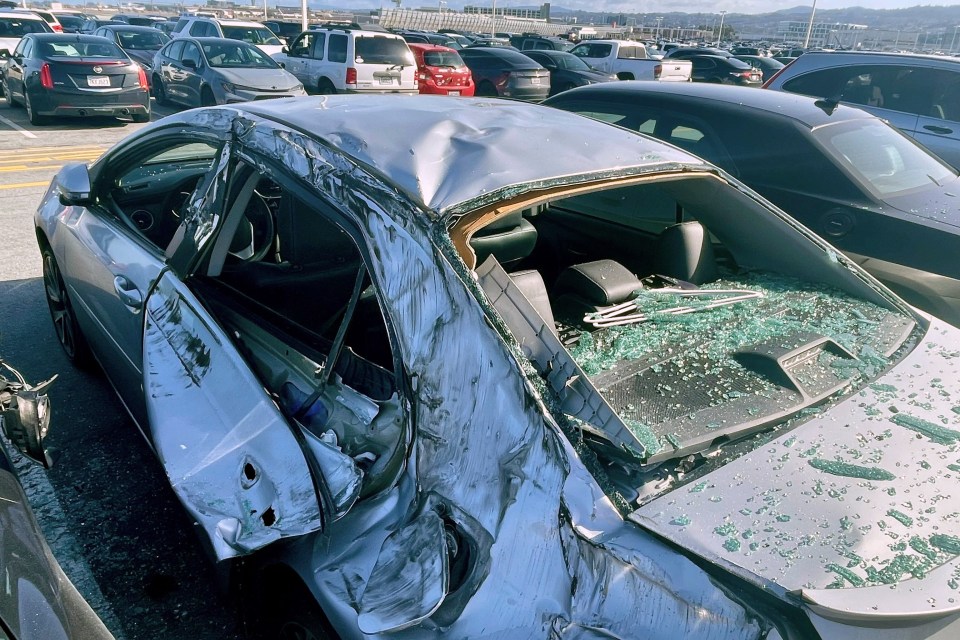 Damage to one of the cars after a wheel fell off a Boeing flight earlier this month