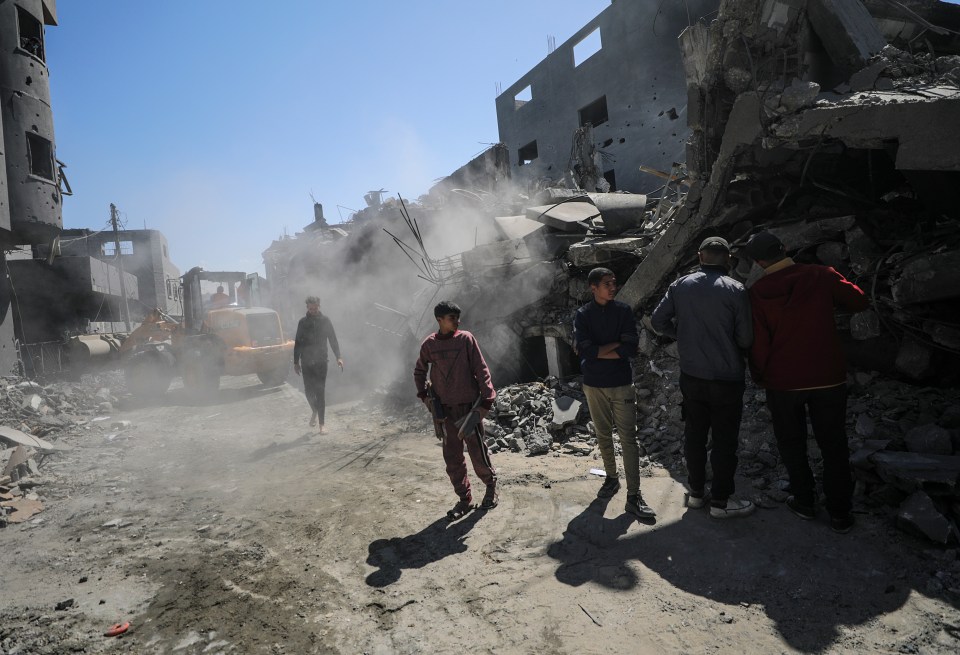 Gazans searching for missing people under the rubble in Al Nusairat refugee camp