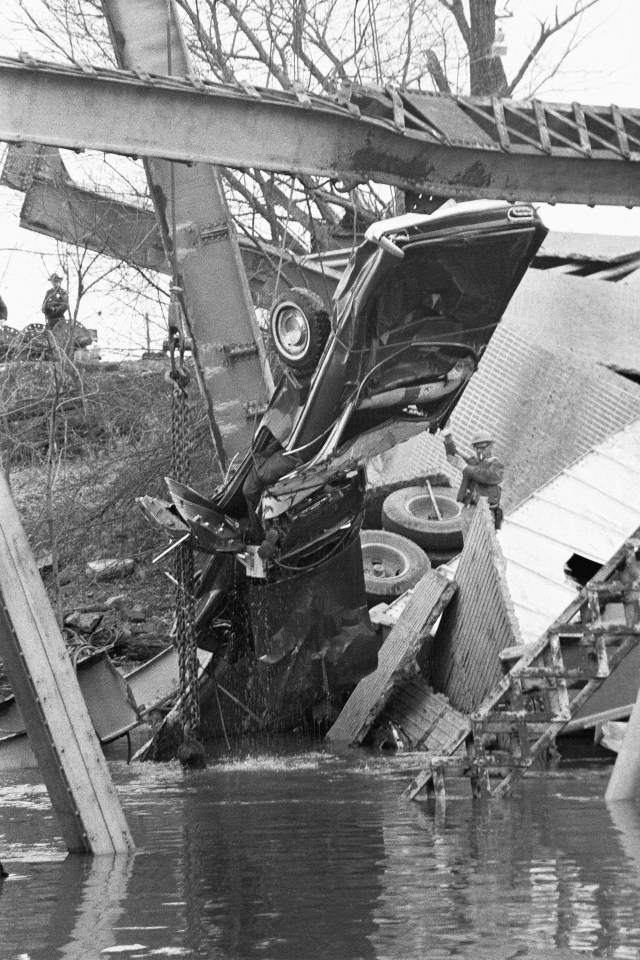 A mangled car is removed from the water after the tragedy in December 1967