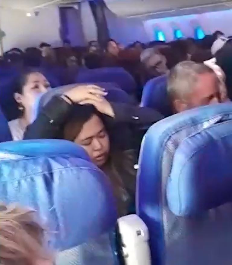 Passengers were seen in distress with their hands above their hands after the horror incident