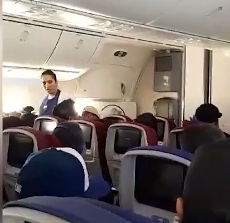 Footage from the flight shows a cabin crew member checking on passengers