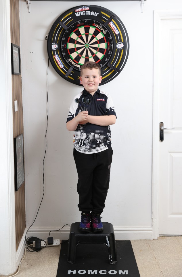 Kai is just 4ft tall so needs a step to collect his darts from the board