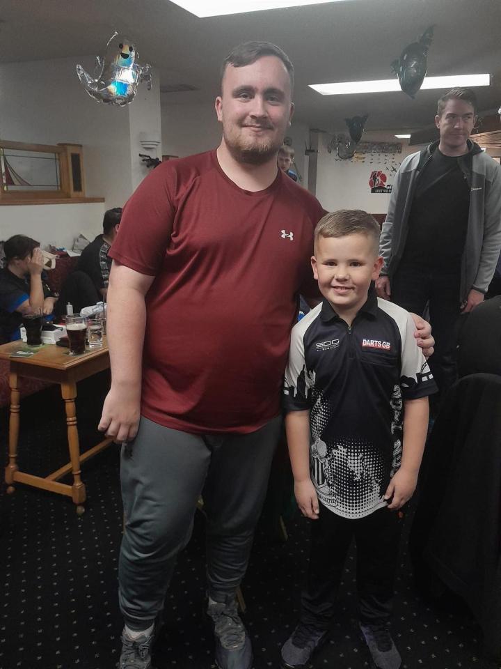 Darts champ Kai with his hero Luke Littler