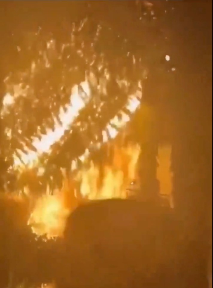 Debris can be seen raining down on people's heads as fire tore through the venue