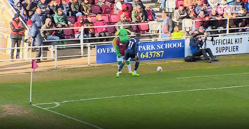 Mendez-Laing appeared to lightly tap the mascot as he went to retrieve the ball