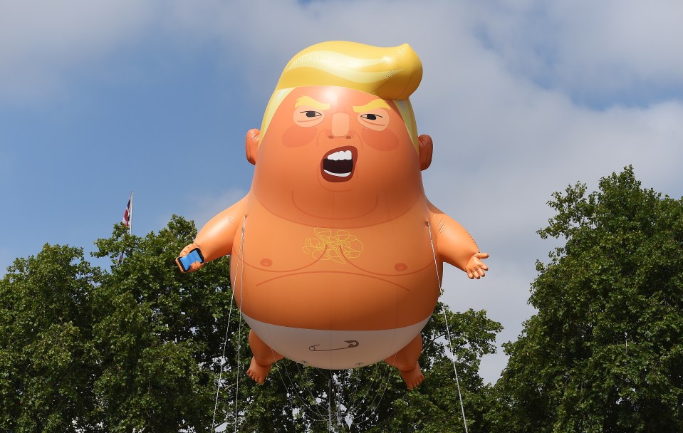 epa06885183 The 'Donald Trump Baby Blimp' balloon flies over Parliament Square during a protest in London, Britain, 13 July 2018. The inflatable dubbed 'Trump Baby' tied to a spot in Parliament Square is to kick off a day of protests against US President Donald J. Trump's visit. Trump is on a working visit to Britain. EPA/ANDY RAIN