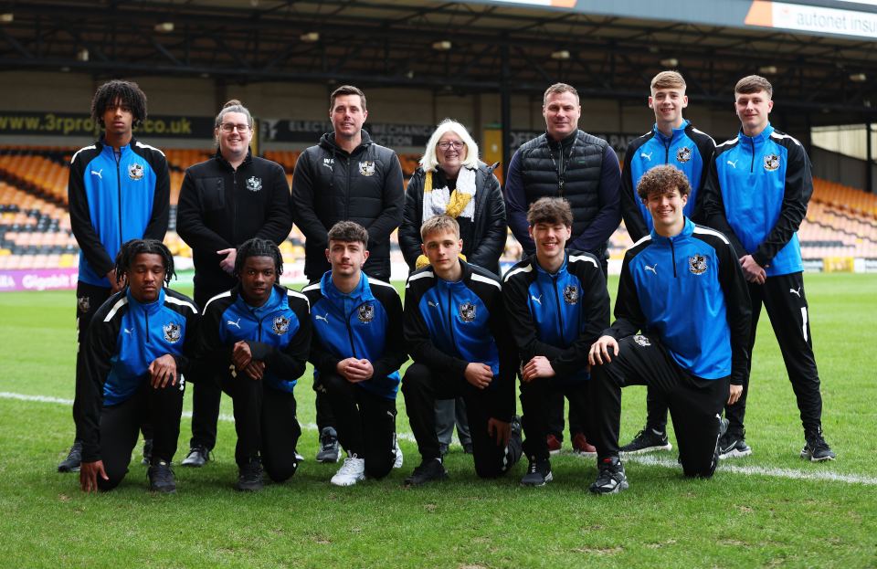 Back, from left: Baylee Dipepa, Patrick Shanahan, Will Ryder, Carol Shanahan, Dave Flitcroft (director of football), Jack Shorrock, James Plant. Bottom, from left: Rhys Walters, Andrew Buah, Logan Cousins, Liam Brazier, Dan Mahaffy, Ben Lomax