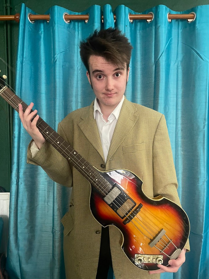 Cathy's son holding the original guitar