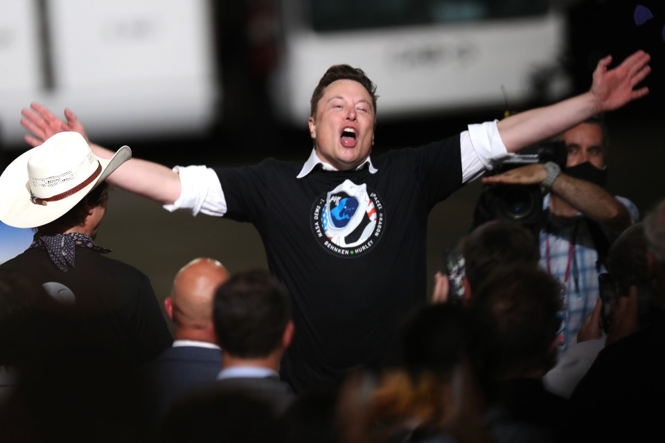 CAPE CANAVERAL, FLORIDA - MAY 30: Spacex founder Elon Musk celebrates after the successful launch of the SpaceX Falcon 9 rocket with the manned Crew Dragon spacecraft at the Kennedy Space Center on May 30, 2020 in Cape Canaveral, Florida. Earlier in the day NASA astronauts Bob Behnken and Doug Hurley lifted off an inaugural flight and will be the first people since the end of the Space Shuttle program in 2011 to be launched into space from the United States. (Photo by Joe Raedle/Getty Images)