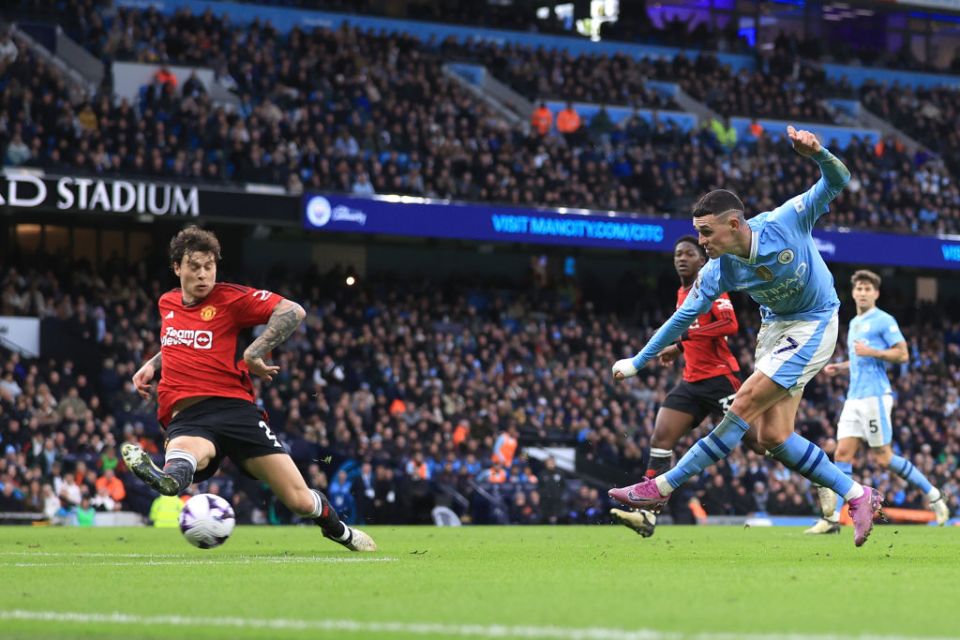 MANCHESTER, ENGLAND - MARCH 3: Phil Foden of Manchester City scoring his second goal during the Premier League match between Manchester City and Manchester United at Etihad Stadium on March 3, 2024 in Manchester, England. (Photo by Simon Stacpoole/Offside/Offside via Getty Images)