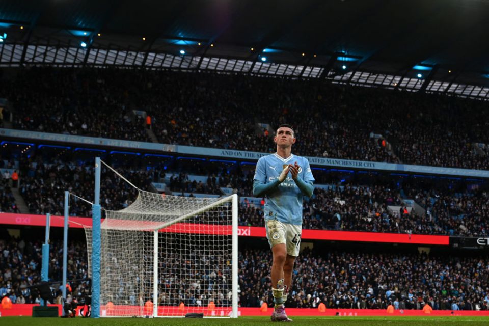 Manchester City's English midfielder #47 Phil Foden applauds fans after the English Premier League football match between Manchester City and Manchester United at the Etihad Stadium in Manchester, north west England, on March 3, 2024. City won the game 3-1. (Photo by Paul ELLIS / AFP) / RESTRICTED TO EDITORIAL USE. No use with unauthorized audio, video, data, fixture lists, club/league logos or 'live' services. Online in-match use limited to 120 images. An additional 40 images may be used in extra time. No video emulation. Social media in-match use limited to 120 images. An additional 40 images may be used in extra time. No use in betting publications, games or single club/league/player publications. /  (Photo by PAUL ELLIS/AFP via Getty Images)